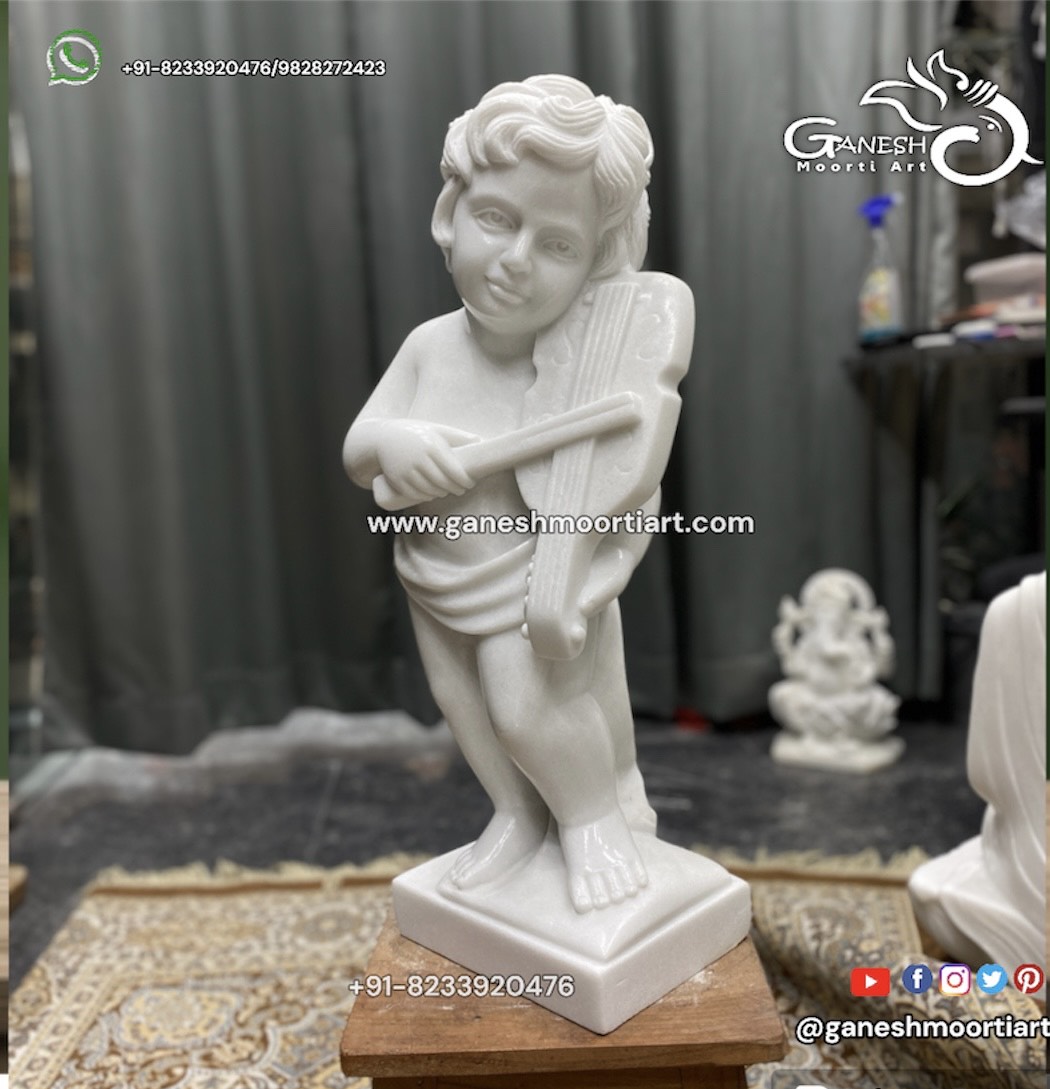 CHILD MUSICIAN sculptures in Carrara marble